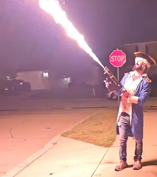 Topping Technologies flamethrower firing a stream of fire at night
